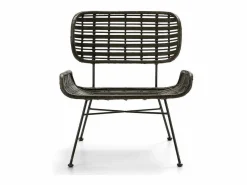 Sillón de mimbre tejido oscuro y patas de metal.^Les Tendances New