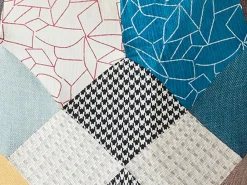 Sillón Elmina en tejido jaspeado patchwork con patas mecedoras^Vente-unique Online
